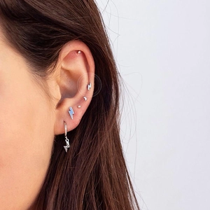 S925 silver stud earring set with lightning moon and bead shapes on ear model