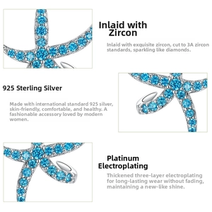 Detail view of S925 sterling silver starfish earrings with blue zircon and platinum plating