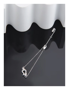 Detail view of S925 sterling silver horseshoe bracelet with pavé cubic zirconia stones