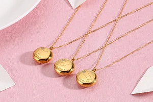 Detailed close-up of gold constellation necklaces for Aries, Taurus and Gemini
