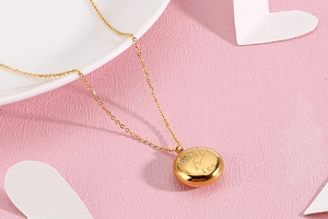 Detailed close-up of gold Leo zodiac necklace with star chart and small embedded diamond