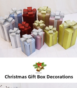 Detailed view of matte frosted Christmas gift boxes with glitter ribbons and bows