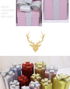 Detailed view of matte glitter Christmas gift boxes in assorted sizes and colors