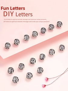 Detailed view of hollow S925 sterling silver DIY letter P bead with floral patterns