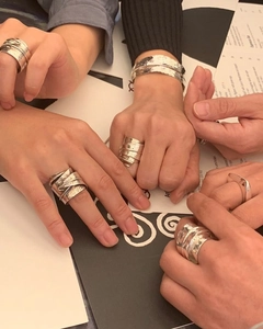 Detail view of s925 sterling silver rings and cuff bracelets with hammered textures