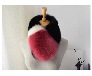 Detail view of tri-color faux fox fur scarf in black, white and burgundy on mannequin