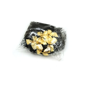 Detail of 2-meter Christmas ribbon with gold bows in transparent protective packaging