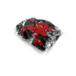 Detail view of 2m Christmas tinsel with red bows packaged in a clear plastic bag