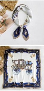 Detailed pattern of a square silk scarf featuring a classic horse carriage and crown print