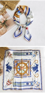 Close-up of nautical square scarf with anchor and helm pattern in white and blue