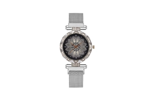 Detailed macro view of the silver mesh strap and flower-shaped dial with sparkling crystals