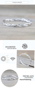 Macro detail of twisted rope ring with shimmering zircon stones in a silver finish