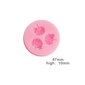 Top view of pink silicone cake mold with 3D pumpkin cavities for DIY baking, 47mm diameter