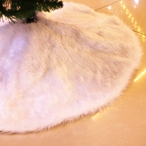White faux fur Christmas tree skirt with plush texture for holiday base decoration