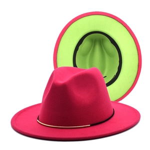 Detail view of fuchsia and lime green contrast wool fedora with gold metal trim
