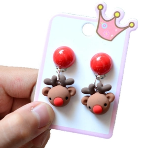 Close-up of resin Christmas reindeer earrings with red nose and festive decorative details