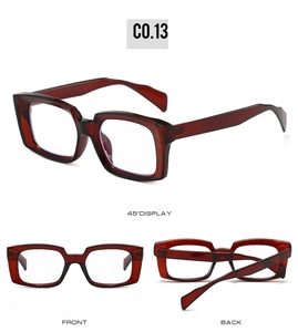 Detail view of bold dark red rectangular sunglasses frame with professional glossy finish