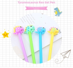 Close-up of colorful dinosaur-themed gel pens with 3D silicone toppers on a book