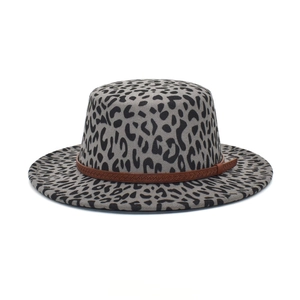 Detail of grey leopard print wool fedora with a brown braided leather strap buckle