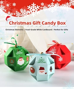 Detail of Christmas candy gift box with ribbons and bells in red green and blue