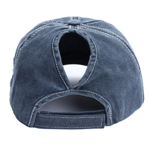 Rear view of distressed denim baseball cap featuring a large ponytail cutout and velcro strap