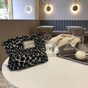 Large capacity canvas makeup bag with black and white leopard pattern and text label