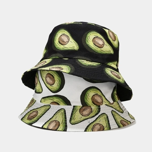 Detailed view of printed bucket hats in black and white with avocado patterns