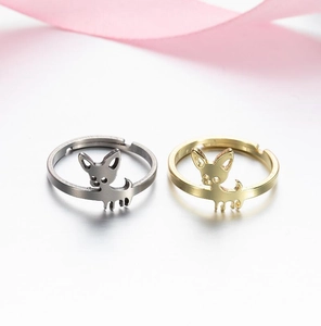 Close-up of gold and silver Chihuahua open rings with adjustable bands on white background