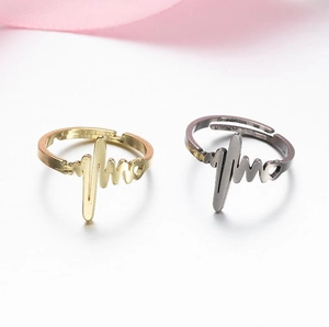 Minimalist heartbeat EKG rings in gold and silver finish with elegant pink ribbon
