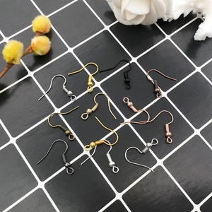 Multiple metallic DIY earring hooks in gold, silver, and rose gold finishes on grid