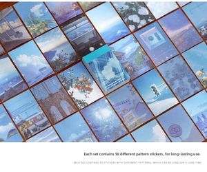 Flat lay of 50 assorted aesthetic landscape stickers for DIY journaling on wooden desk