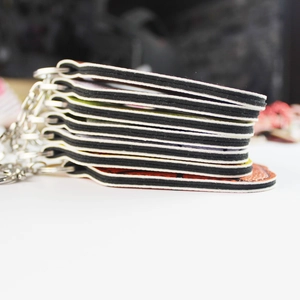 Sporty leather hand sanitizer keychain layered design with metal ring and foam core