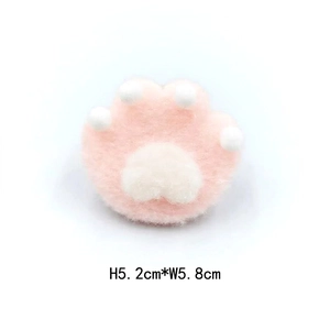 Detail showing plush cat paw brooch dimensions H 5.2cm and W 5.8cm in pink and white