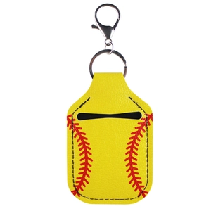 Yellow faux leather baseball sanitizer keychain with red stitching and spring hook