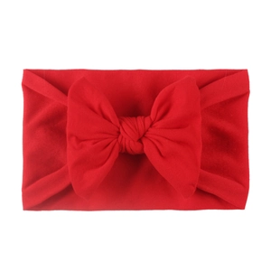 Soft nylon baby headband featuring a vibrant red oversized bow for infants and toddlers