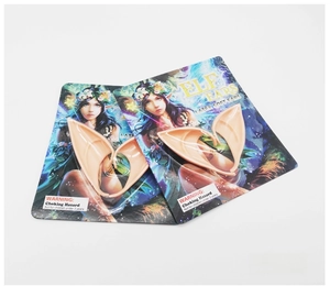 Close-up of two pairs of latex elf ears for cosplay in original retail packaging