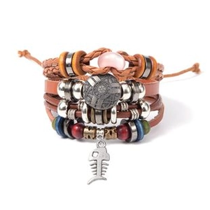 Detail view of multilayer leather bracelet featuring a metal fishbone pendant and beads
