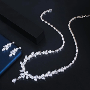 Macro detail of silver wedding jewelry set featuring marquise and teardrop cubic zirconia