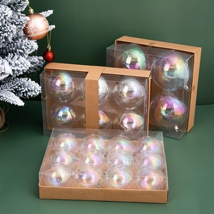 Set of iridescent transparent Christmas ball ornaments on a snow-covered tree branch