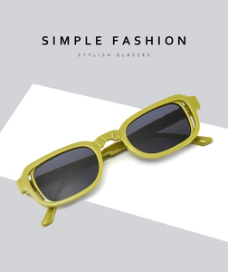 Close-up of olive green retro square frame sunglasses with stylish dark lenses