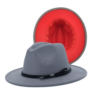 Detail of grey wool felt fedora with vibrant red lining and leather buckle strap