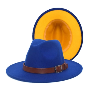 Royal blue wool fedora detail showing contrast yellow interior and brown leather band