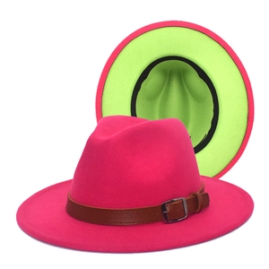 Detail of wool fedora hat featuring rose pink crown and neon green brim contrast