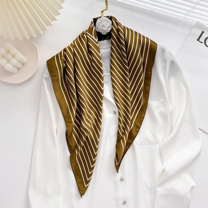 Olive green striped faux silk neck scarf tied elegantly on a white blouse for women