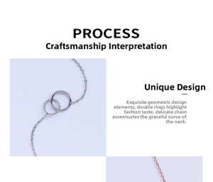 Detail showing the double interlocking rings pendant with a twisted metal texture