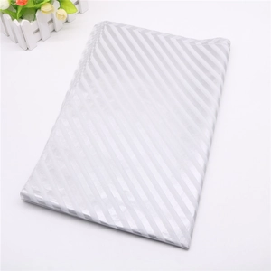 Close-up of silver diagonal stripe wrapping paper with glossy finish for gift packaging