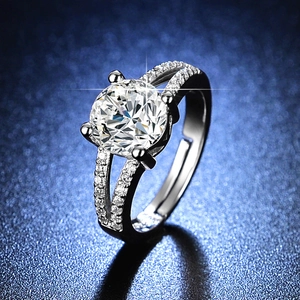 Detailed macro shot of a six-prong adjustable silver ring with sparkling round centerpiece