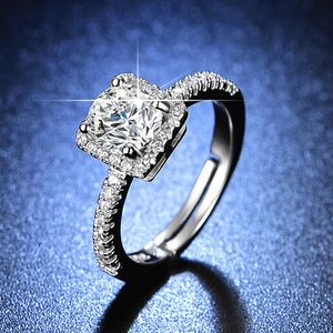 Macro shot of silver adjustable ring with square halo moissanite and pave band detail