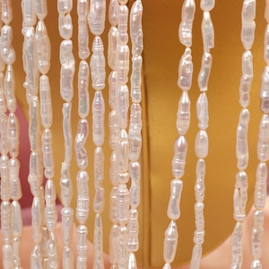 Strand of high luster baroque freshwater pearls featuring unique irregular textures