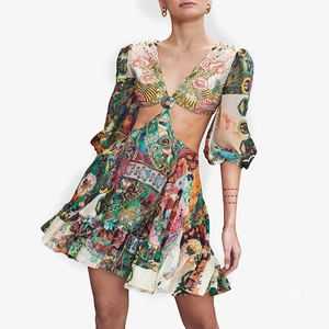 Bohemian printed mini dress with V-neck, waist cut-outs and colorful patchwork patterns